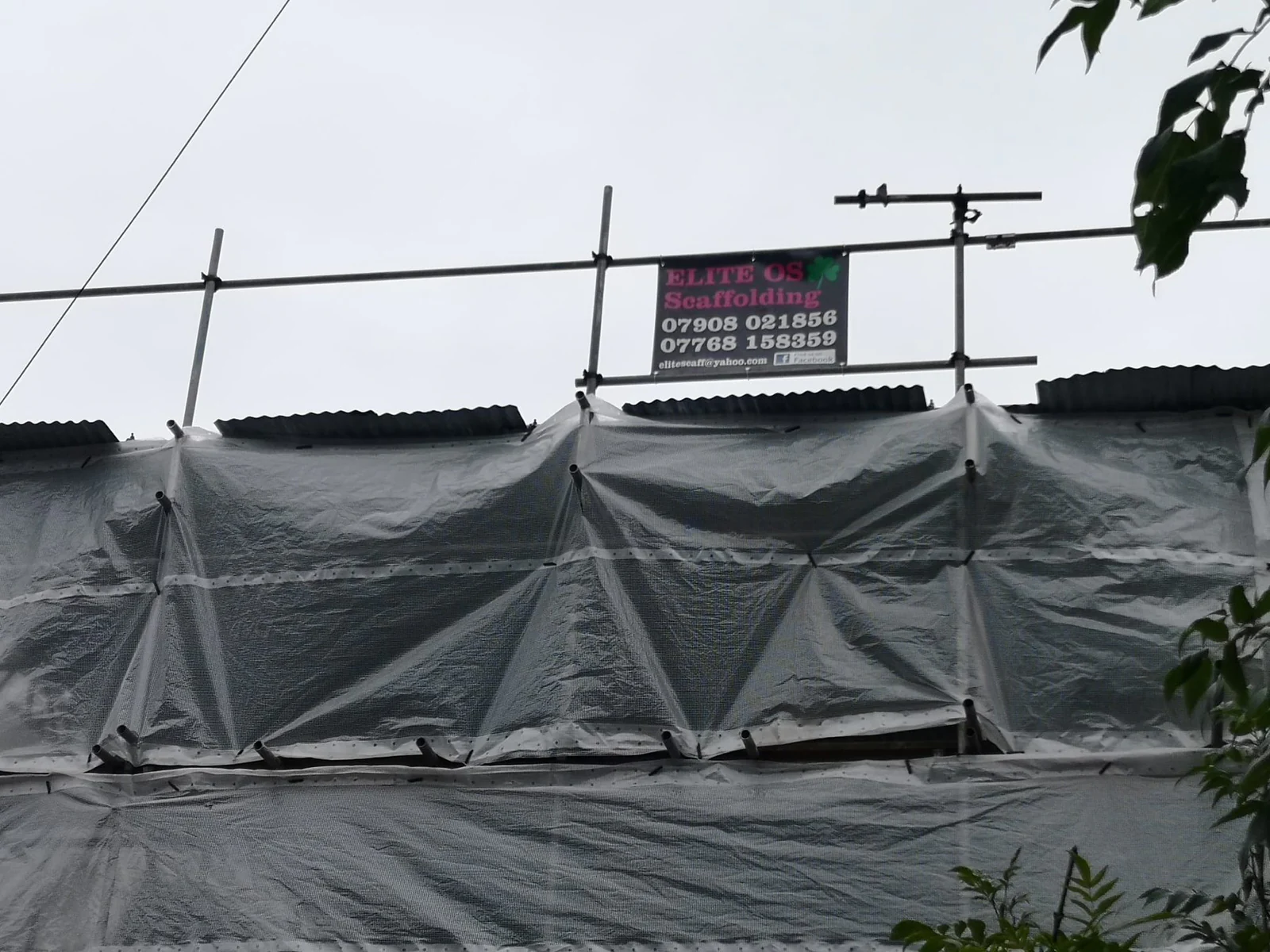 Monarflex temporary roof with an Elite site board on the standards